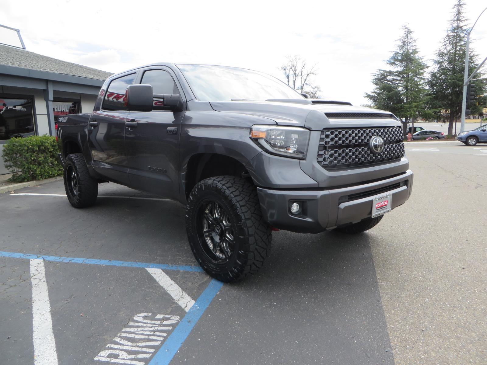 2021 CHARCOAL /GREY Toyota Tundra SR5 (5TFDY5F16MX) with an 5.7L V8 OHV 16V engine, automatic transmission, located at 2630 Grass Valley Highway, Auburn, CA, 95603, (530) 508-5100, 38.937893, -121.095482 - Features a Zone Offroad level kit, 20" SOTA wheels, 35" Nitto Ridge Grappler tires, Fox rear shocks, Air bags, front and rear TRD sway bars, and Window tint. - Photo #2